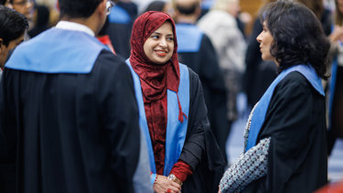 Three new Fellows talking at an RCR admissions ceremony.